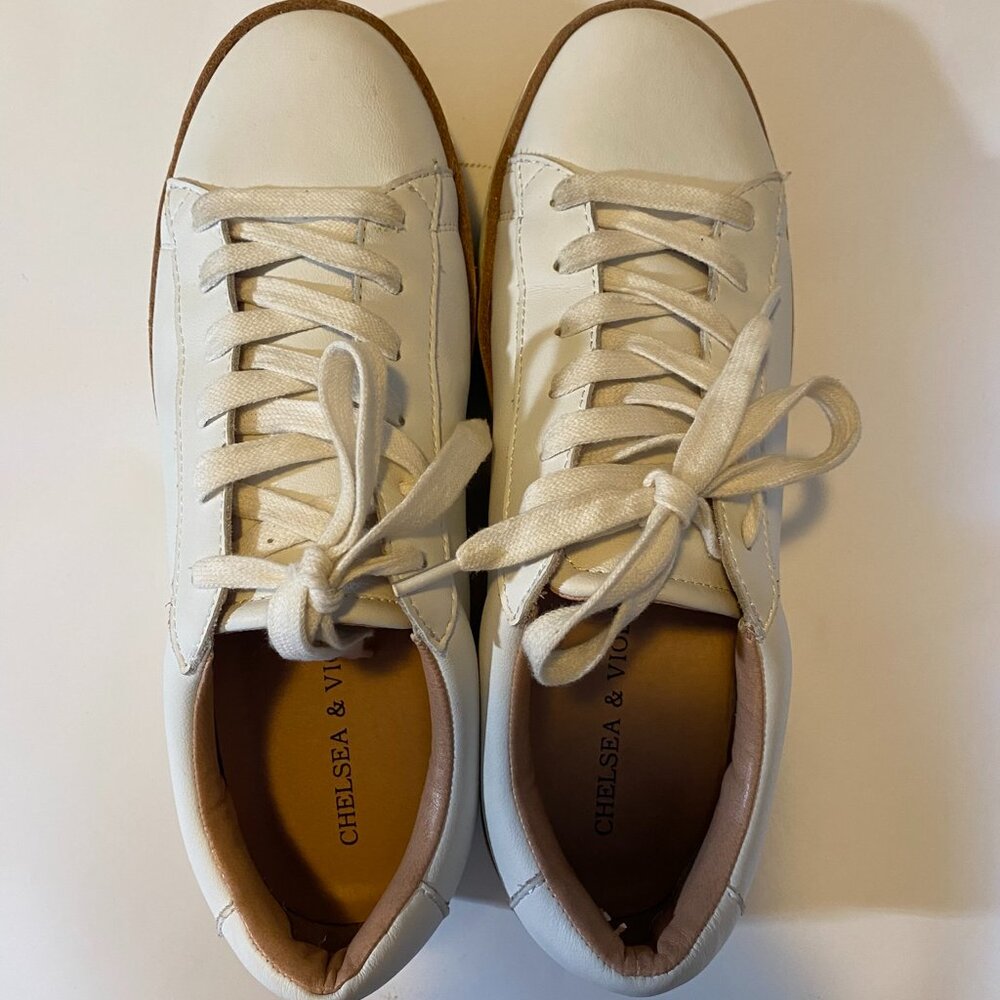 White leather platform tennis shoes with tan leather trim